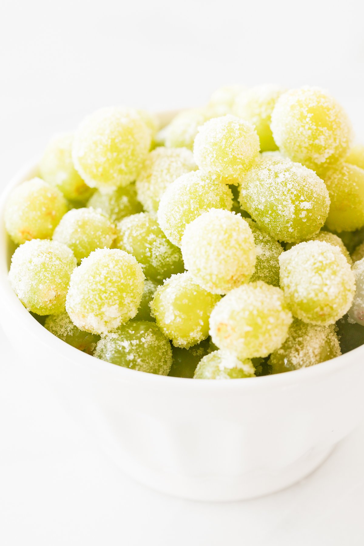 white bowl of green champagne grapes 