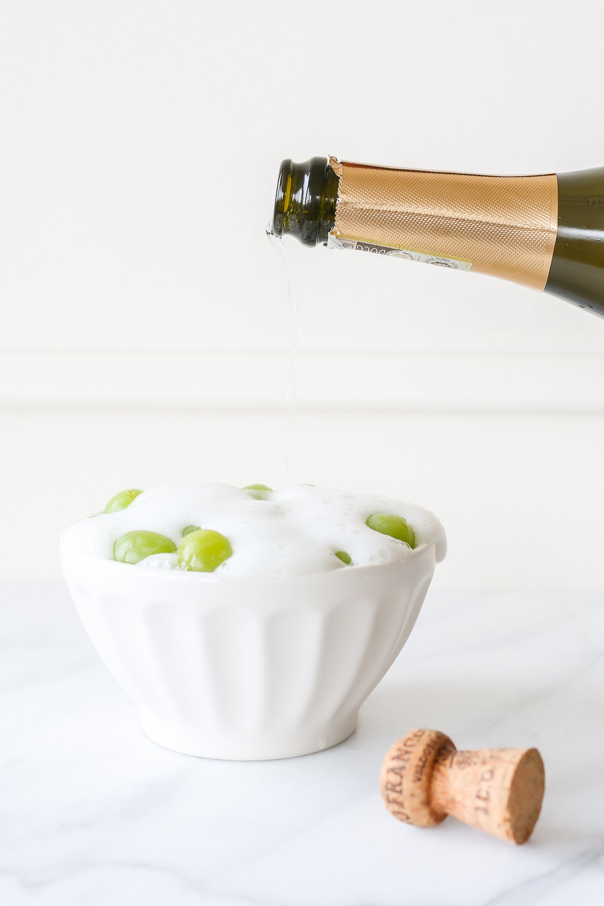 bowl of grapes covered in champagne