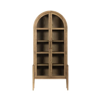 A wooden bookshelf with an arched top, glass doors, and multiple shelves offers a Pottery Barn look for less.