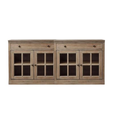 A wooden sideboard with two drawers and four glass-paneled cabinet doors, each featuring a knob handle, revealing interior shelves. Achieve that Pottery Barn look for less with this elegant piece.