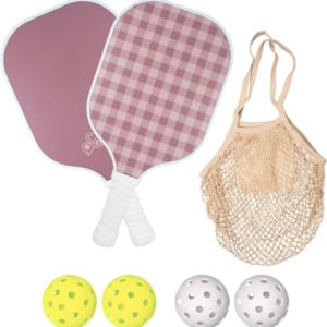 Two pickleball paddles with a pink checkered design, a beige netted bag, and four pickleballs—two yellow and two white—make the perfect set. Snag this stylish bundle on Prime Day for unbeatable fun on the court.