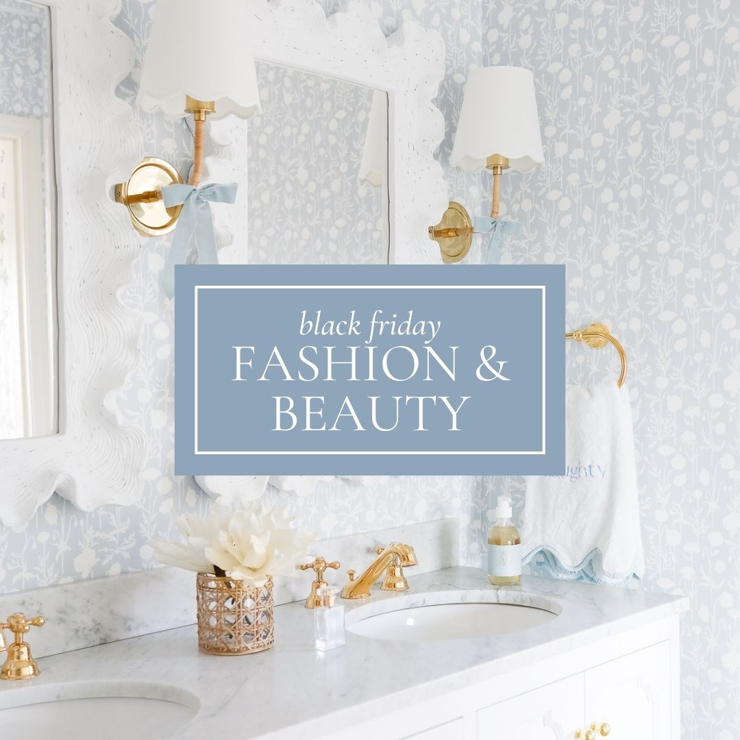 Elegant bathroom with a marble countertop, a mirror, two lamps, and a towel. A sign reads 