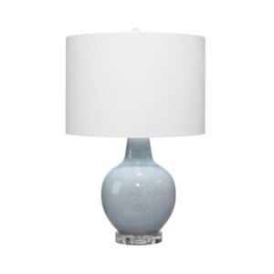 A ceramic table lamp with a round, light blue base and a large white cylindrical lampshade offers a chic pottery barn look for less, set against a white background.