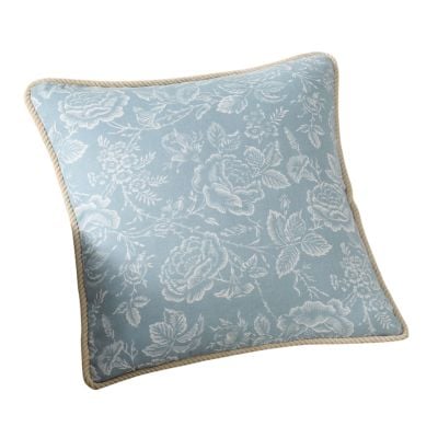 Square blue pillow with a white floral pattern and beige piping along the edges, offering a Pottery Barn look for less, shown against a white background.
