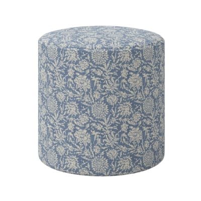 A round ottoman with a blue and white floral pattern on its fabric upholstery, offering a Pottery Barn look for less, shown against a plain white background.