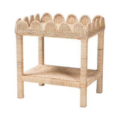 A rectangular wicker side table with decorative scalloped edges on the top and a lower shelf, offering a Serena and Lily look for less.