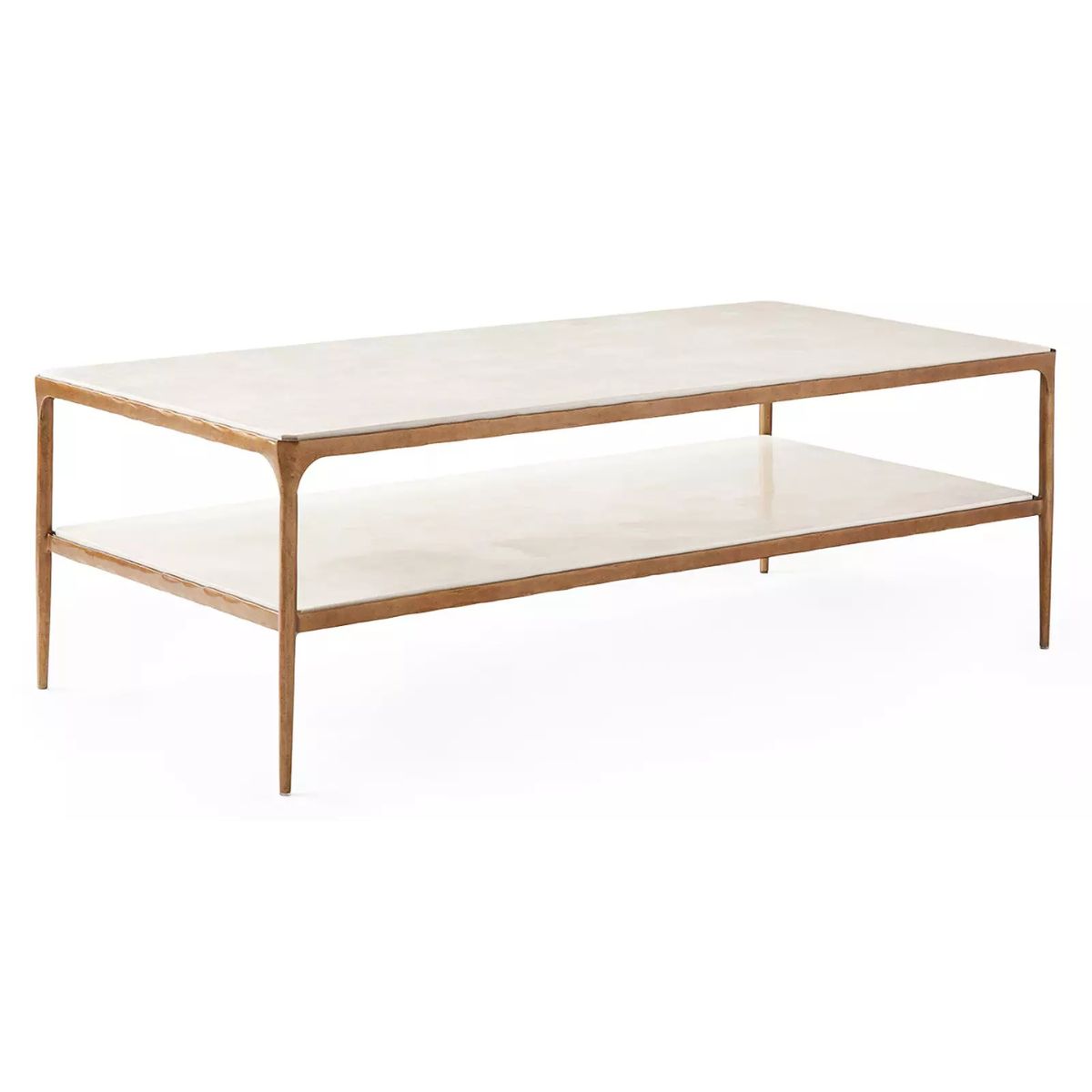 A rectangular coffee table with slim, gold-finished legs and a matching lower shelf, offering a chic Serena and Lily look for less.