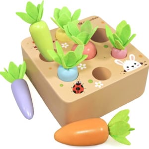 Wooden toy puzzle with removable carrots of various colors and green felt leaves, set on a block adorned with a bunny and ladybug—perfect as Easter basket fillers.