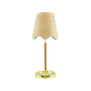 Table lamp with a gold base, a cylindrical stem wrapped in rattan, and a beige fabric lampshade with a wavy edge—get the Serena and Lily look for less, shown against a white background.