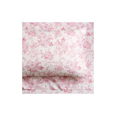 Experience the LoveShackFancy look for less with this pink floral pillowcase and sheet set on a pristine white background.