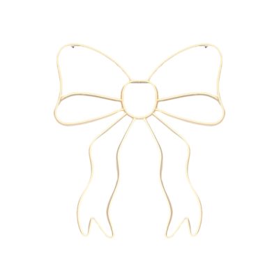 Gold wire bow with ribbon tails on a white background, capturing the essence of LoveShackFancy Look for Less.