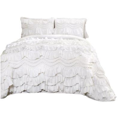 A ruffled white bedding set, capturing that LoveShackFancy look for less, comes with two matching pillowcases on a bed.