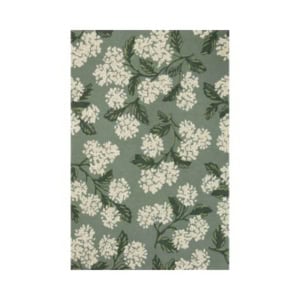 Green rectangular rug with a repeating pattern of white flowers and green leaves. Check our rug size guide to ensure you choose the perfect rug size for your space.