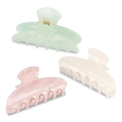 Three translucent plastic hair claw clips in pastel colors—green, pink, and white—arranged on a white background, perfect as cute Easter basket fillers.