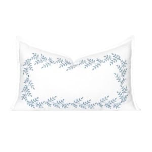 Rectangular white pillow with a blue leafy vine pattern forming a border around the edges, offering a chic Serena and Lily look for less.