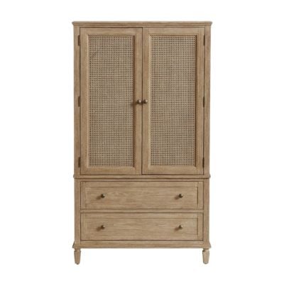 A wooden armoire with two rattan-front doors on top and two drawers with metal knobs on the bottom offers a Pottery Barn look for less.