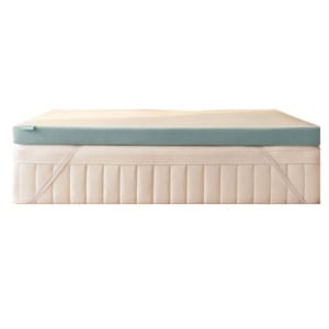 A mattress with a light blue foam topper secured by elastic straps, shown against a white background.