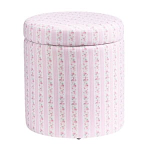 A round ottoman with a removable lid, upholstered in fabric featuring pink and white vertical stripes with small floral patterns.