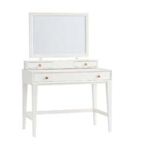 White vanity table with a large rectangular mirror, three drawers with round brass knobs, and four straight legs.