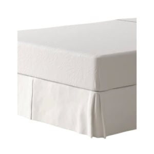A white fitted sheet covering a mattress with a matching white bed skirt hanging down to the floor.