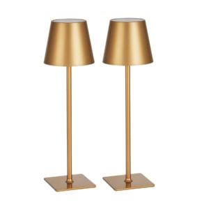 Two modern gold-colored table lamps with slender stems and square bases, side by side against a white background.
