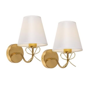 Pair of wall-mounted gold sconces with curved arms, round bases, and white fabric lampshades.