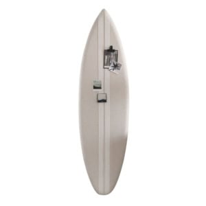 A beige surfboard mounted vertically on a white wall, used as a display board with photographs and small items attached to it.