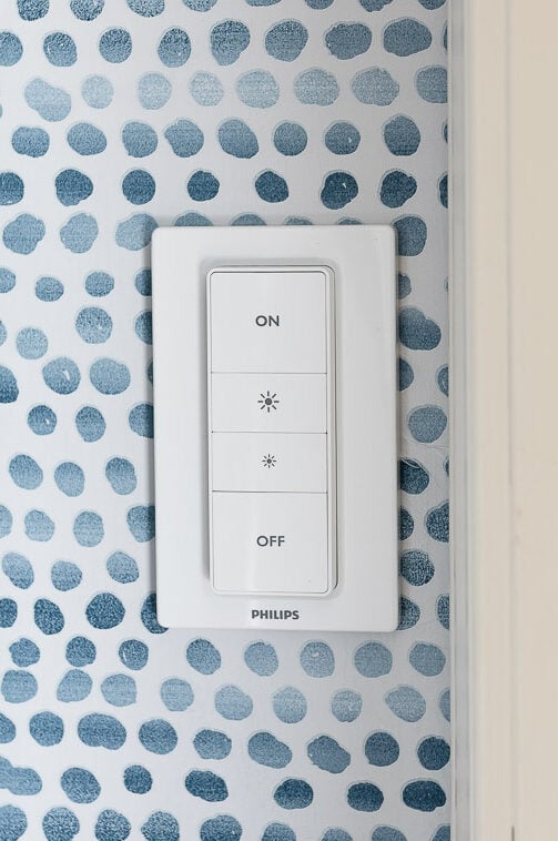 A light switch with a blue and white polka dot pattern available on Amazon.