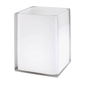 Square white bathroom tumbler encased in clear acrylic.