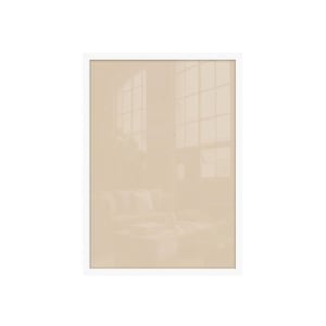 A framed print showing a hazy, monochromatic interior scene with large windows and a sofa.