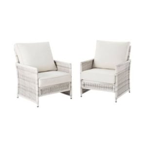 Two matching armchairs with gray woven frames and off-white cushions.